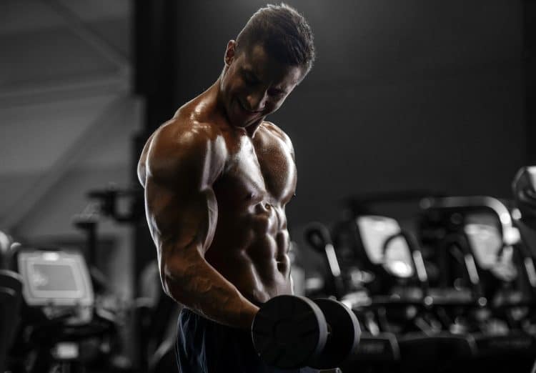 Bodybuilder Pumping Up Muscles