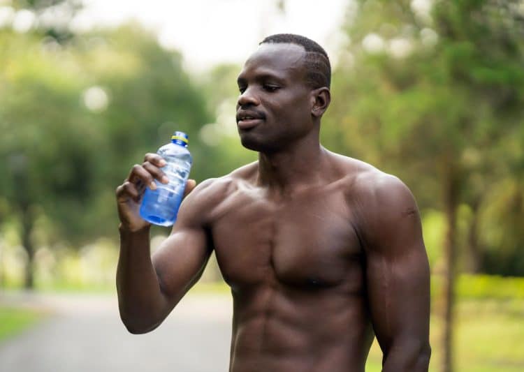Fit Male Drinking Water