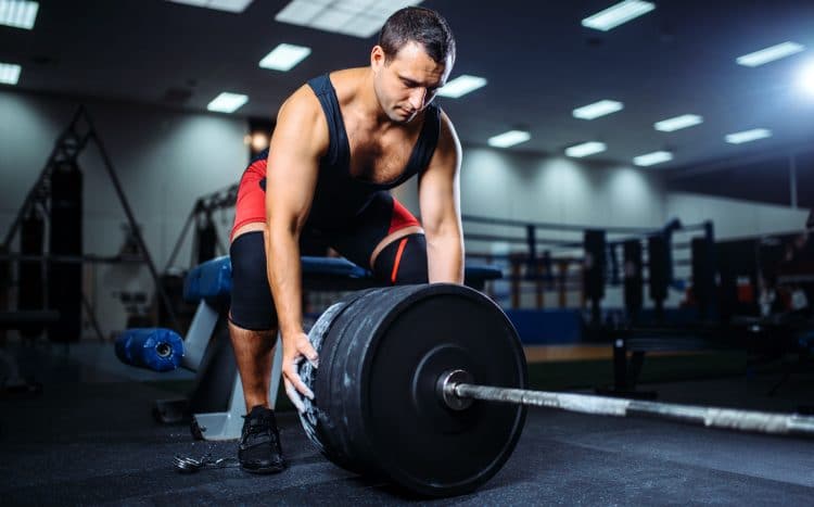 Powerlifter Loading Weights