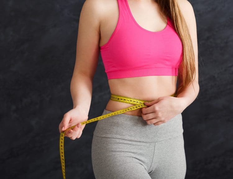 Woman Measuring Her Waist