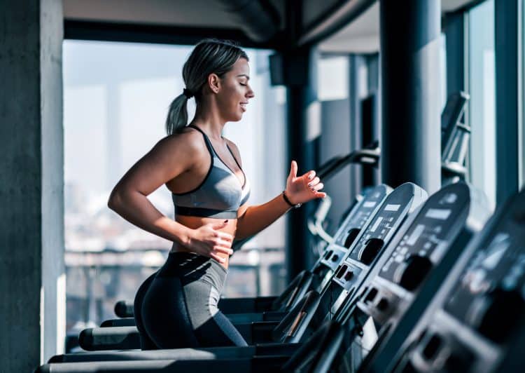 Woman Running On Treadmill