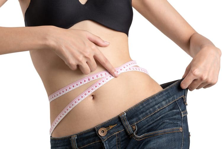 Woman Showing How Much Weight She Lost
